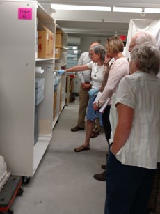 people in museum storage area